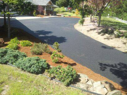 Repaved driveway with landscaped yard