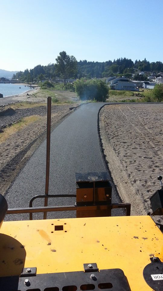 POV from road roller paving a dirt road