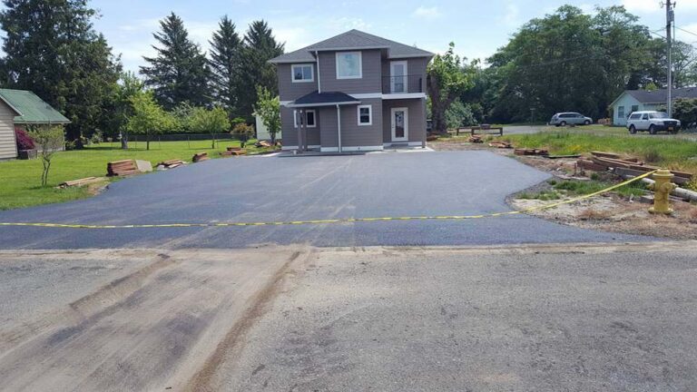Paved driveway for a large two story home